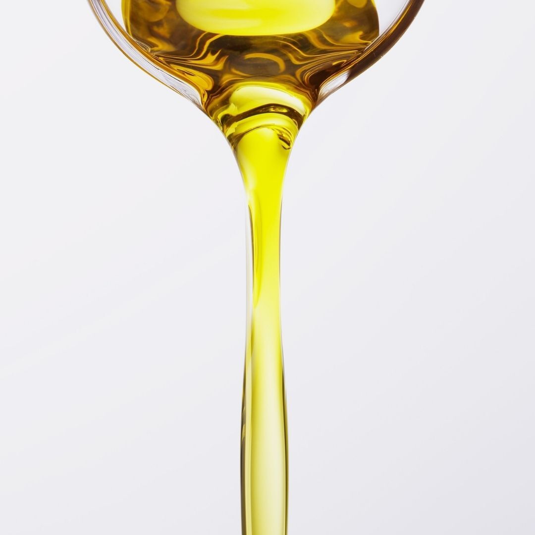 oil being poured from a bottle